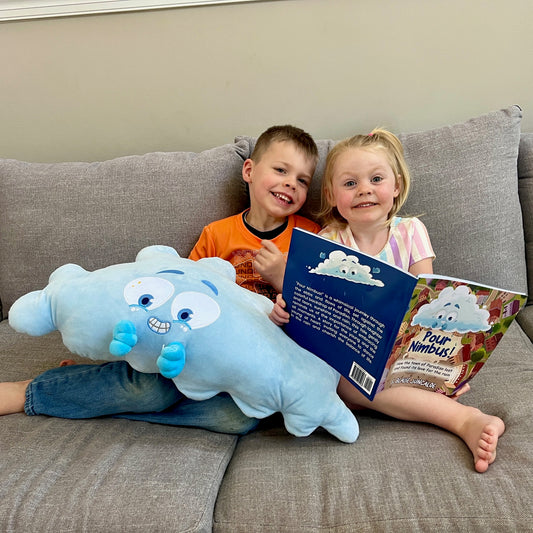 Children reading Pour Nimbus picture book and cuddling with the Nimbus plushie pillow