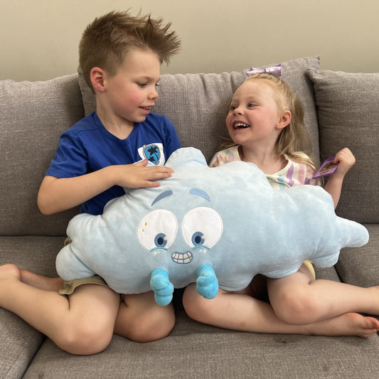 children playing with Nimbus the plushie pillow